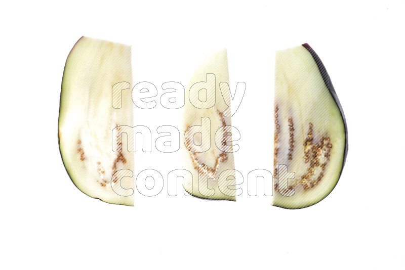 Eggplant slices on illuminated white background