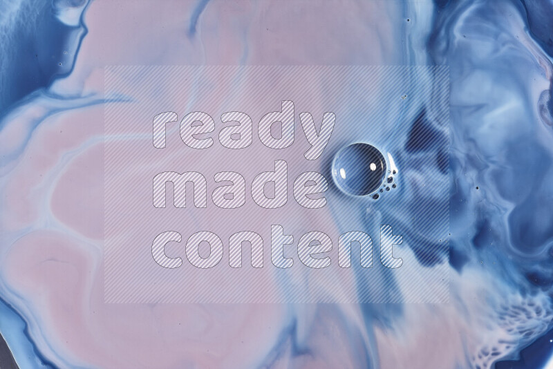 A close-up of abstract swirling patterns in blue, red and white