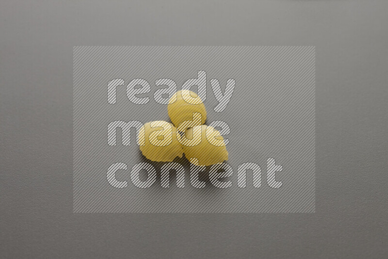 Shells pasta on grey background