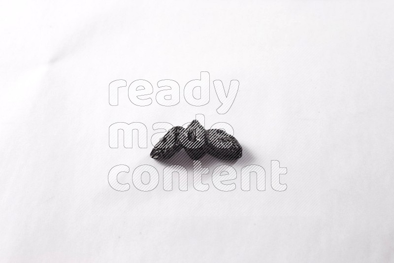 Dried plums on white background