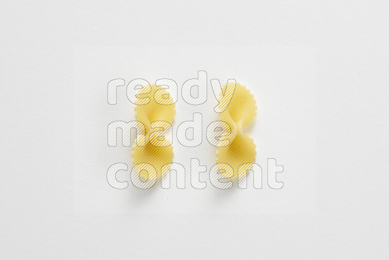 Fiocchi pasta on white background