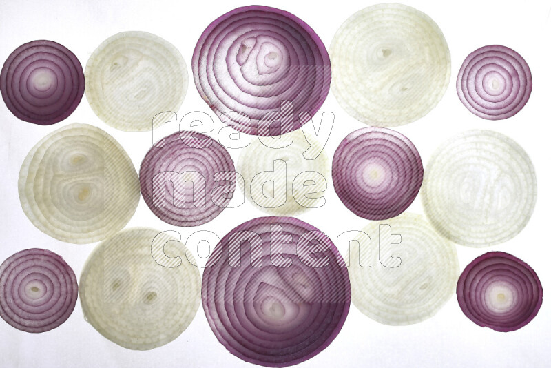 Onion slices on illuminated white background