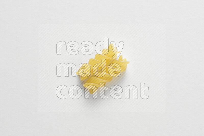 Fusilli pasta on white background