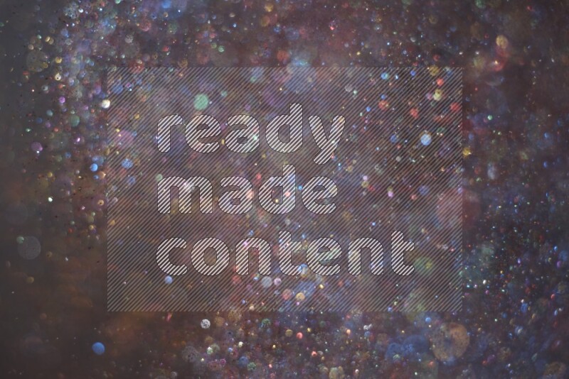 Multicolored glitter powder isolated on black background