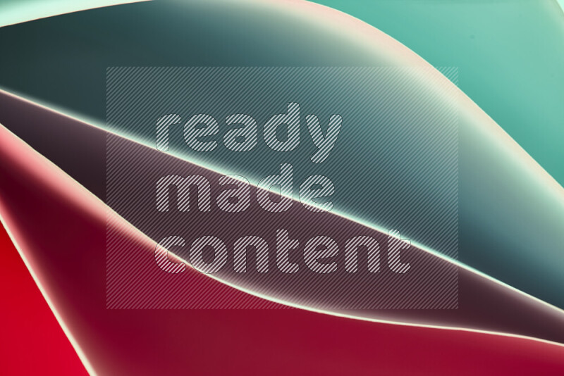 This image showcases an abstract paper art composition with paper curves in green and red gradients created by colored light