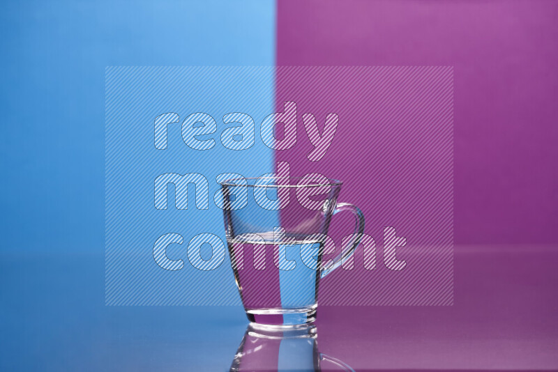 The image features a clear glassware filled with water, set against blue and purple background