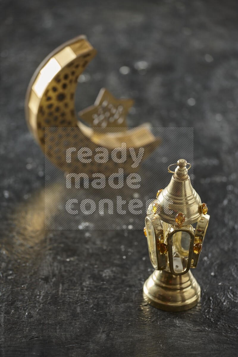 A crescent lantern with classic lantern on textured black background