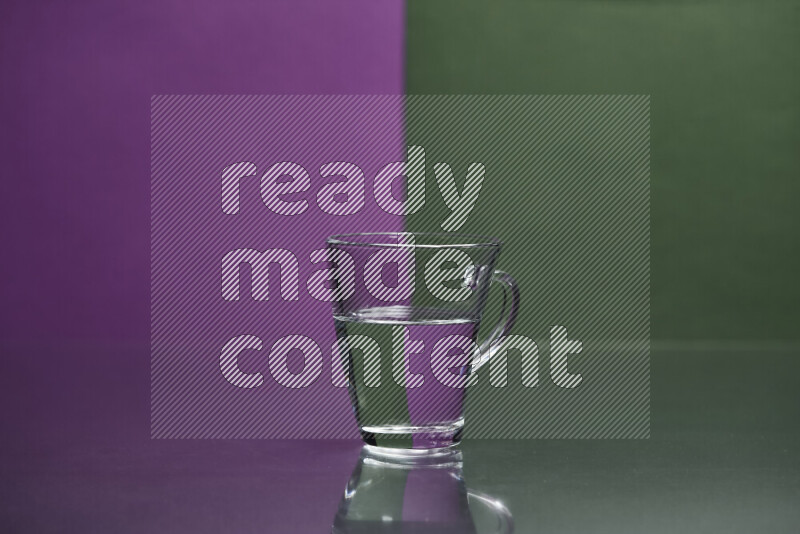 The image features a clear glassware filled with water, set against purple and dark green background