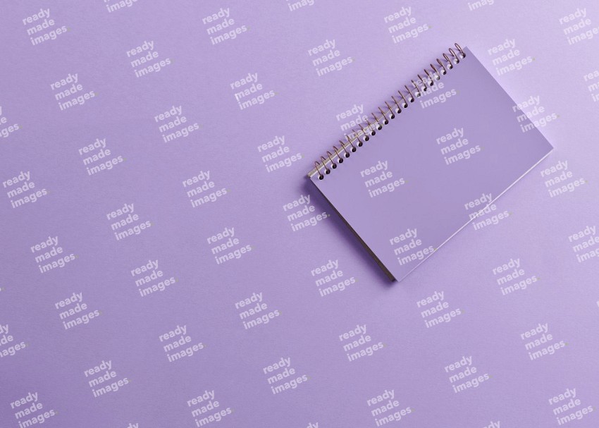 A purple notebook on purple background (Back to school)