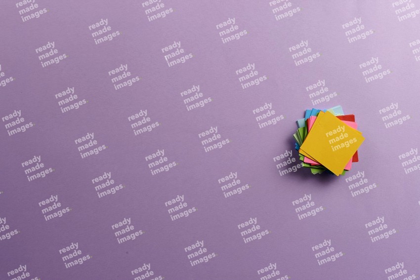 Multicolored sticky notes on purple background (Back to school)