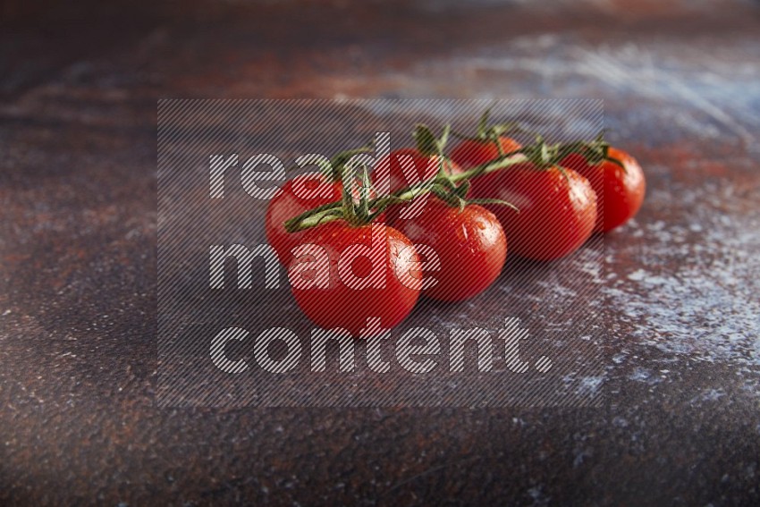 red cherry tomato vein on a reddish rustic metal background 45 degree