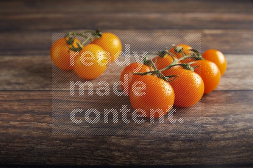 Mixed cherry tomato veins on a textured wooden background 45 degree