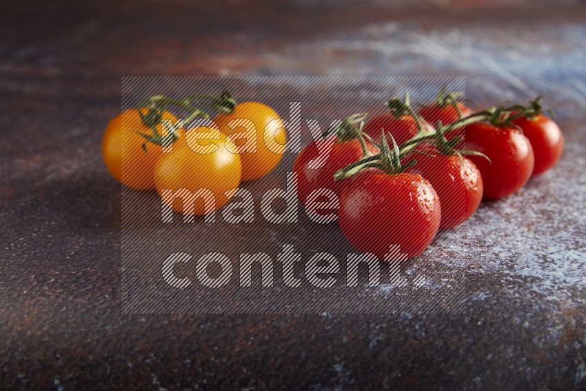 Mixed cherry tomato veins on a textured reddish rustic metal background 45 degree